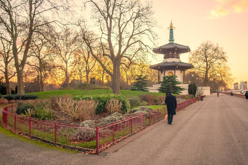 someone walking past the London Peace Pagoda in Battersea Park on a brisk winter days