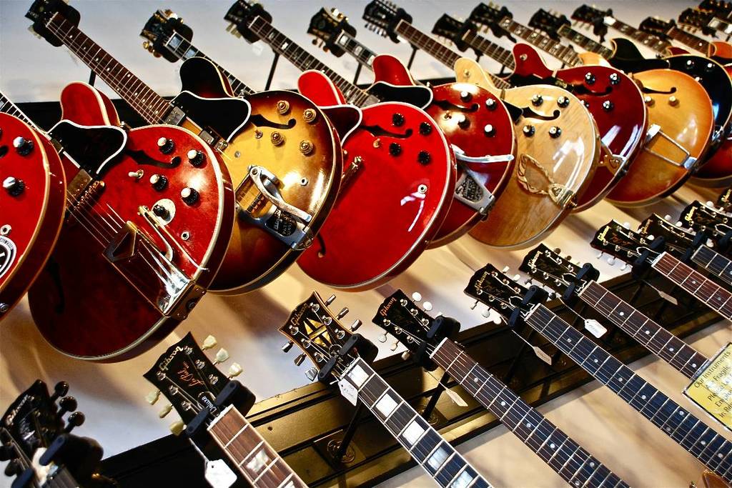 A row of guitars in a music shop