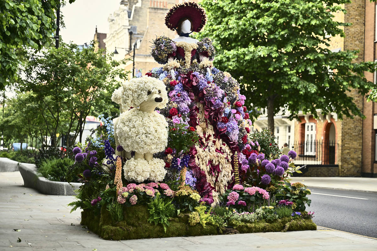a cute and cuddly floral display of a teddy bear