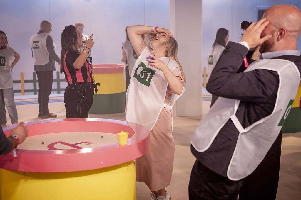people play the Marbles game at Squid Game experience
