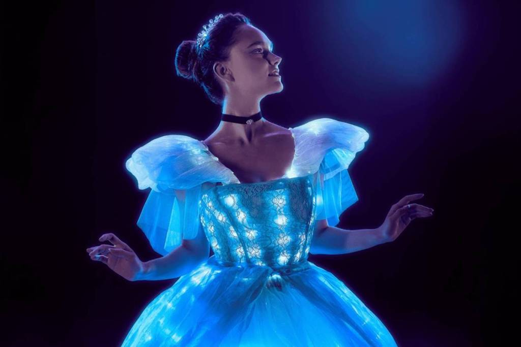 woman performs as part of ballet of lights show