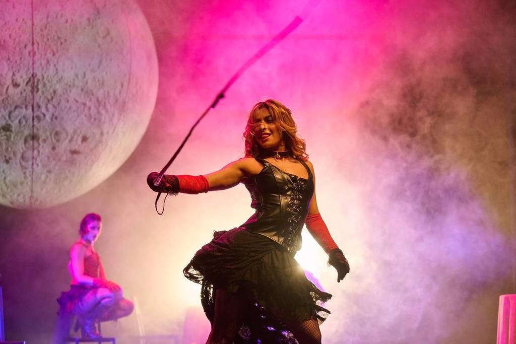 A dancer performs with a whip at House of Cabaret.