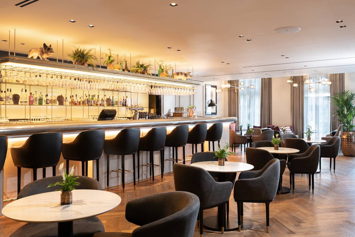 The bar and some tables inside Kitchen at Holmes