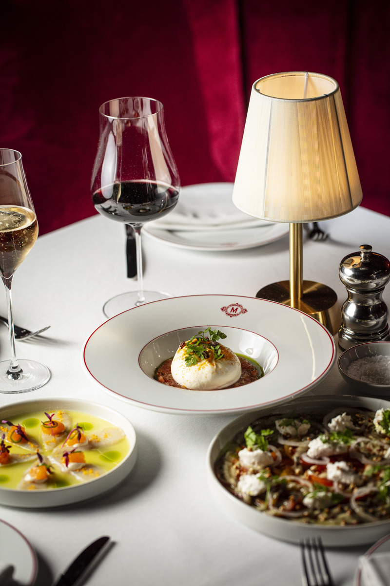 an array of fancy french food on a table