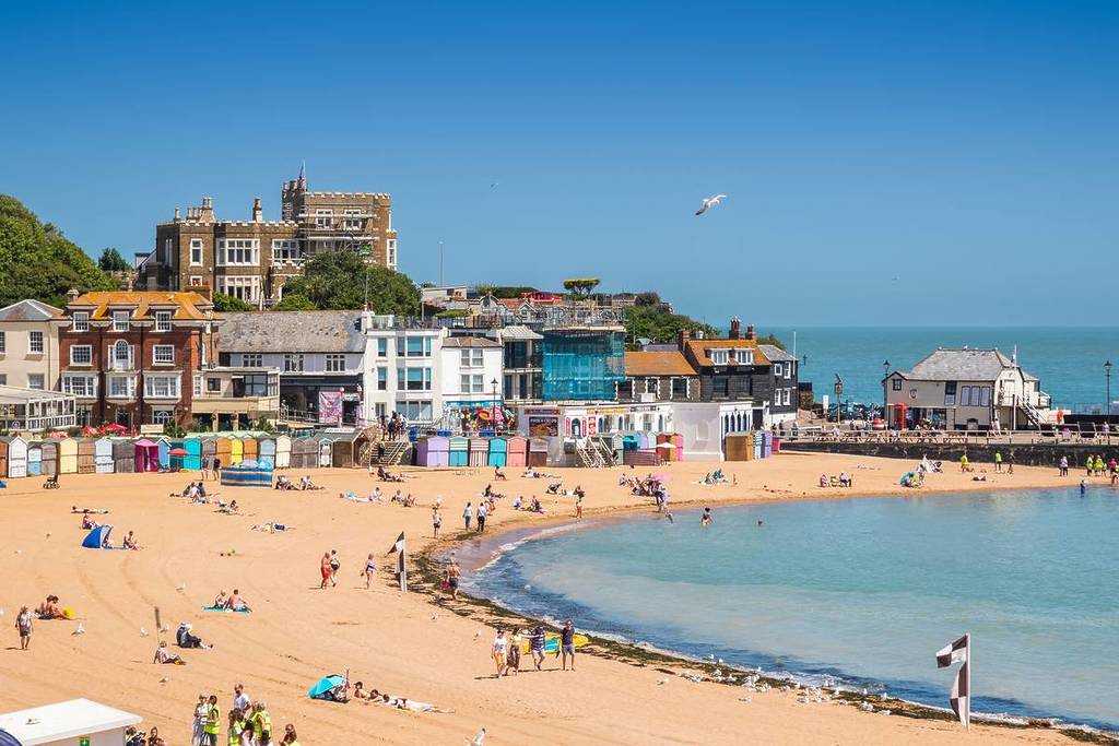 Beach huts on the sandy beach at Viking Bay in the seaside town of Broadstairs