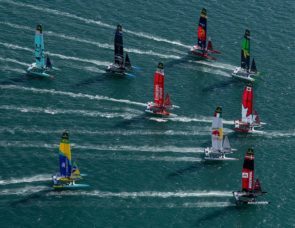 The fleet led by Switzerland SailGP Team helmed by Sebastien Schneiter ahead of ROCKWOOL Denmark SailGP Team, Canada NorthStar SailGP Team, Australia SailGP Team, Red Bull Italy SailGP Team, Spain SailGP Team, Emirates Great Britain SailGP Team, New Zealand SailGP Team, Mubadala Brazil SailGP Team and USA SailGP Team in action on Race Day 1 of The Rolex SailGP 2025 Championship ITM New Zealand Sail Grand Prix in Auckland, New Zealand. Saturday 18 January 2025. Photo: Jason Ludlow for SailGP.