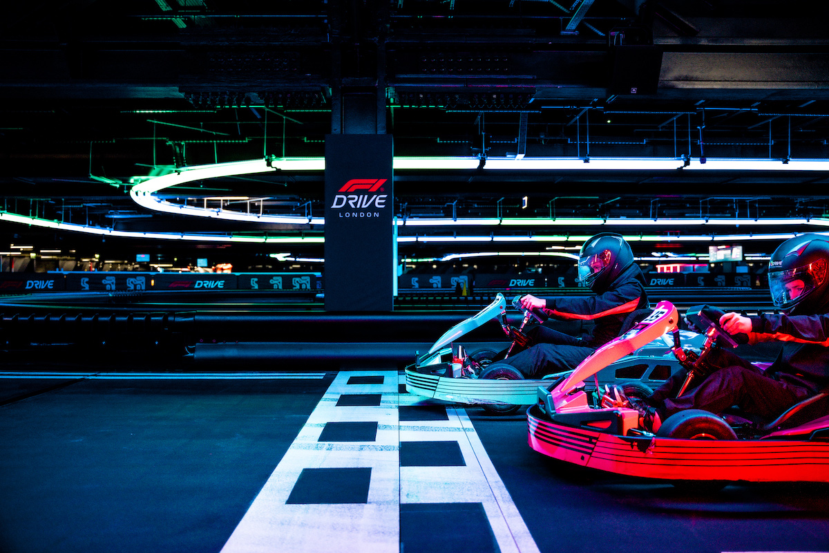 F1 arcade racing simulators - two players in carts at the starting line