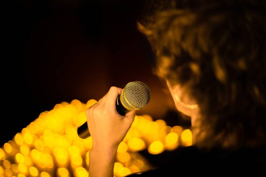 A singer performing at a Candlelight concert