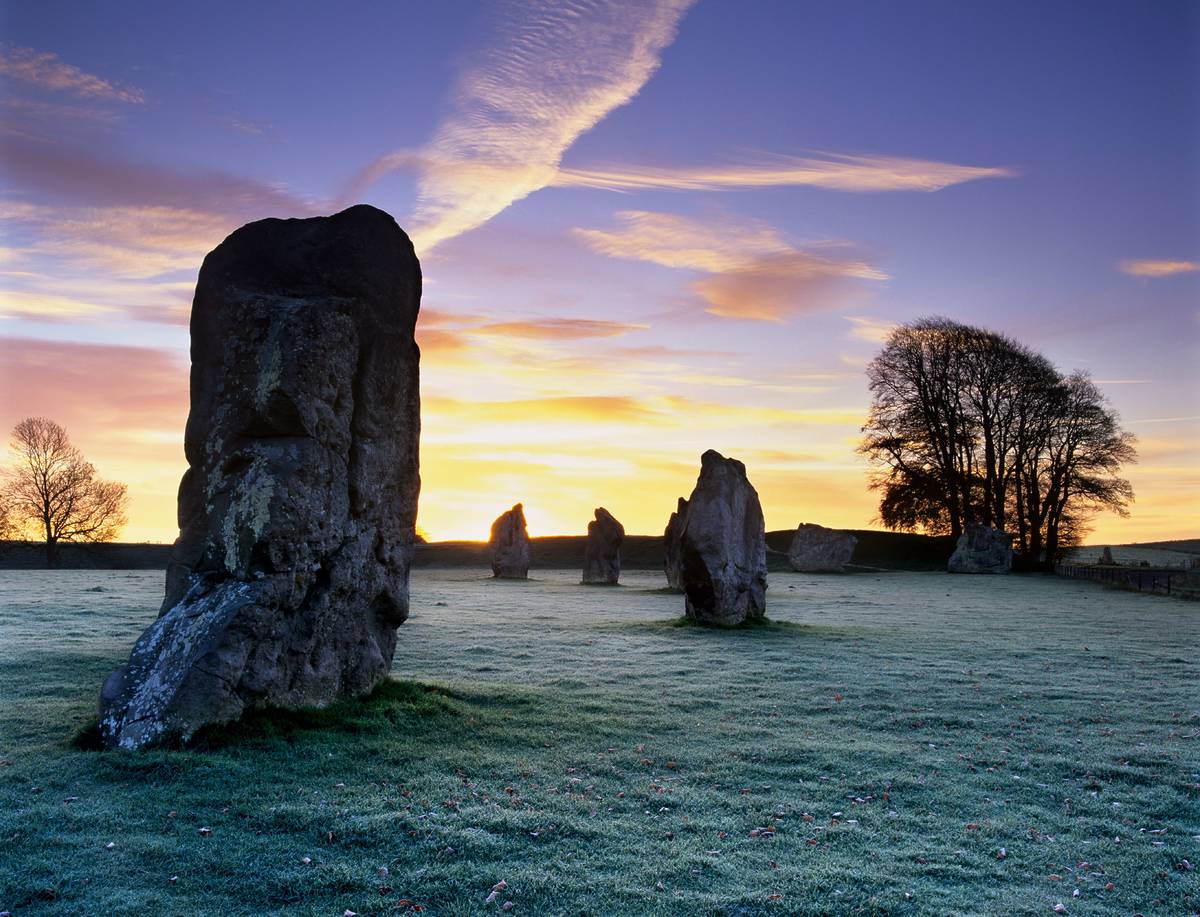 Part of the stone circle at Avebury at sunset