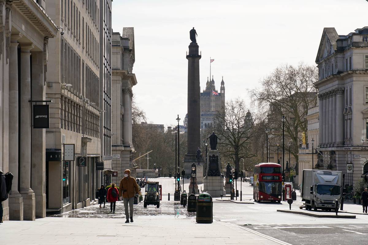 Regents Street St James's with a few pedestrians and a bus