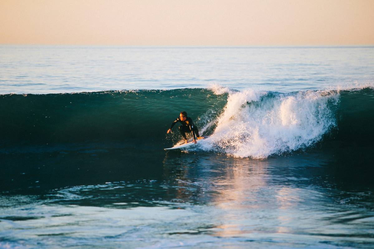 surfing on one of the world's top 100 beaches
