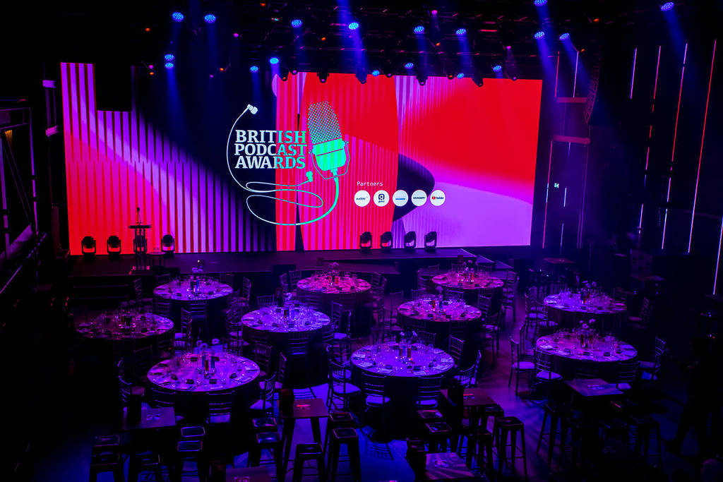 Tables set up in a room for the British Podcast awards