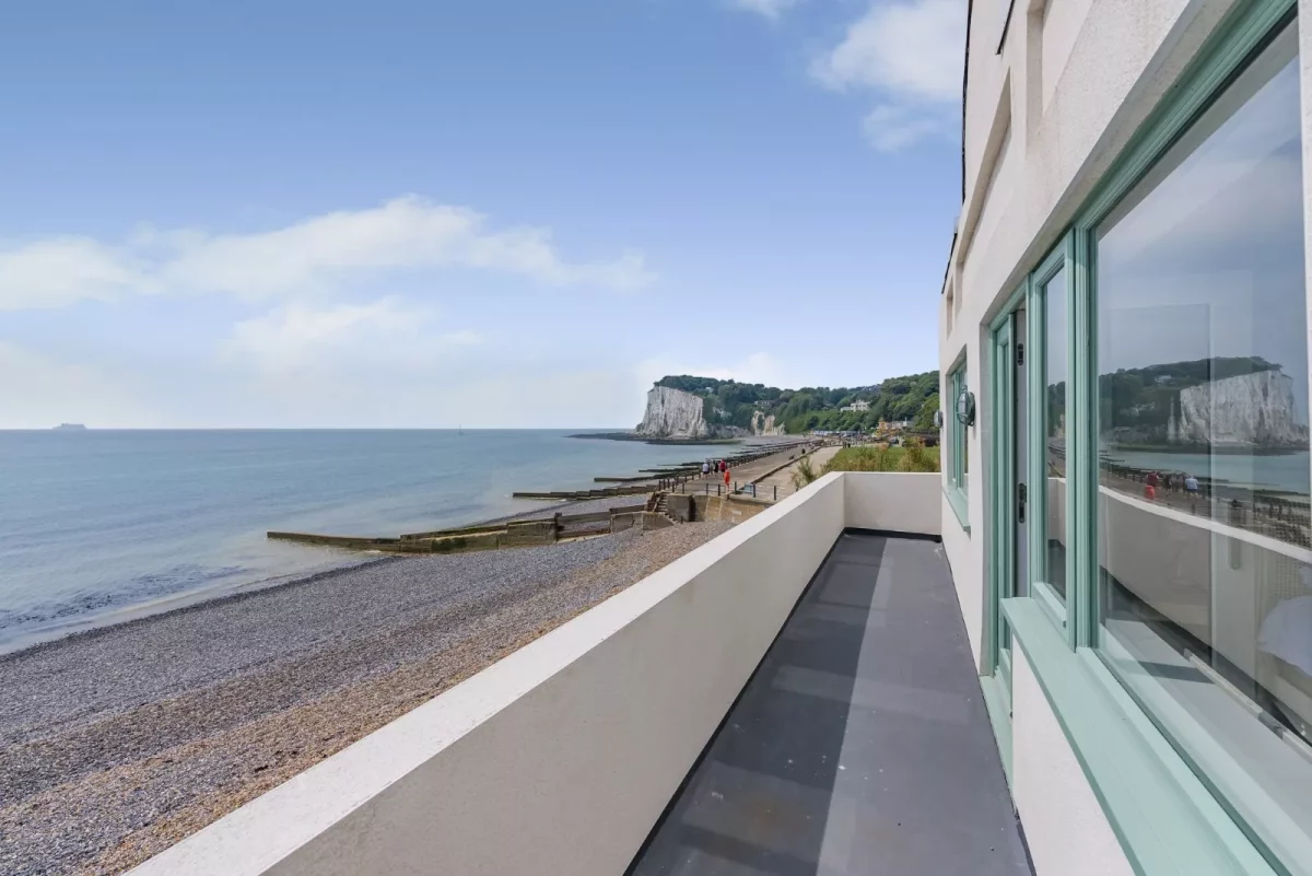 The front of a property that offers sweeping views across the seaside