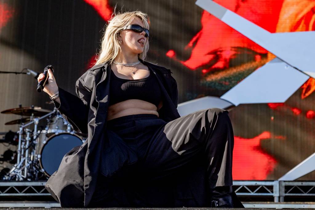Reneé Rapp performing on stage at Coachella in 2024