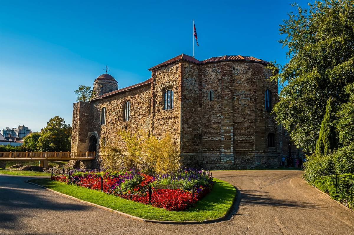 Colchester castle under a bright blue sky