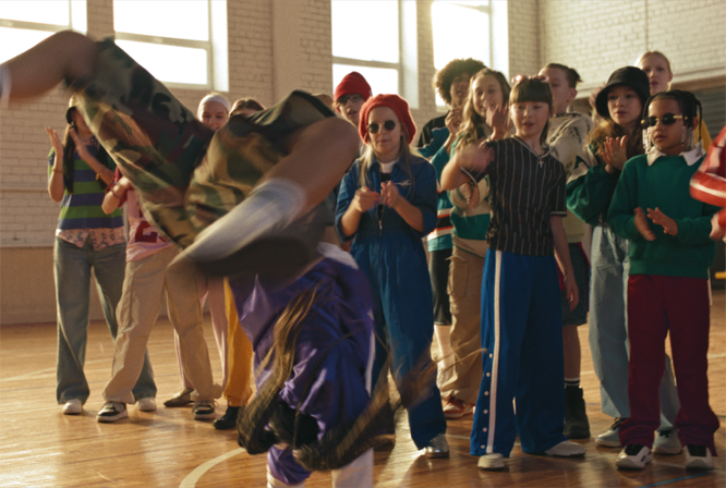 Kids watching a breakdancer at a class