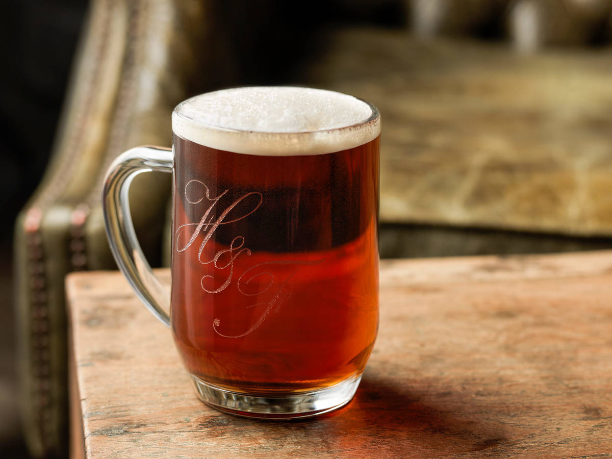 a mug of amber coloured real ale emblazoned with an 'h&f' insignia
