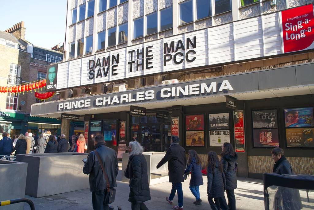 Prince Charles Cinema with the sign reading 'Damn The Man. Save The PCC'
