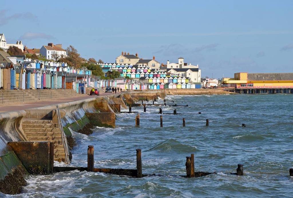 Walton on the Naze, Essex, United Kingdom, October 10, 2019. Promenade, seashore and colourful beach huts on a sunny autumn day. Walton on the Naze, Essex, United Kingdom, October 10, 2019