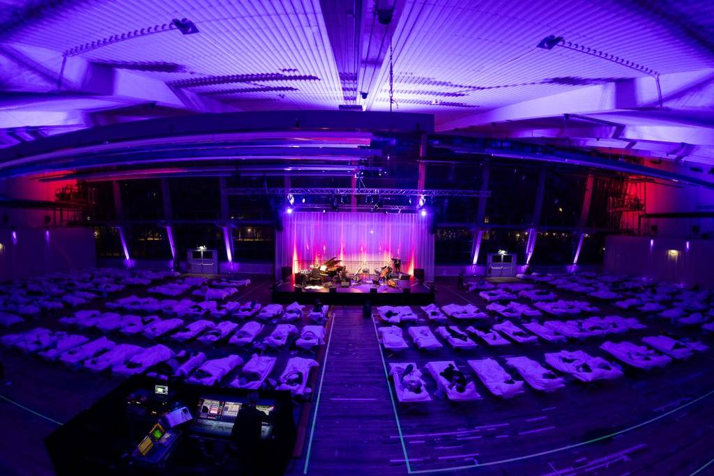 SLEEP beds in front of a stage at Vienna concert