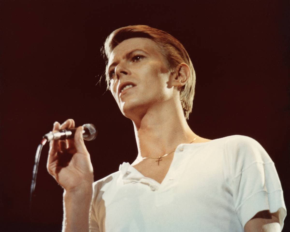 David Bowie performing on stage.