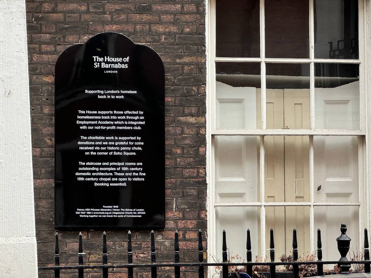 The sign outside the House of St Barnabas detailing its charity work