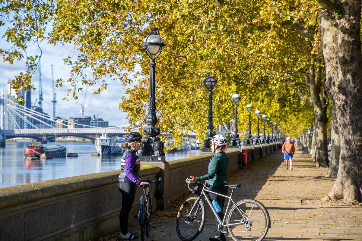Two cycllists chatting to each other on the Embankment