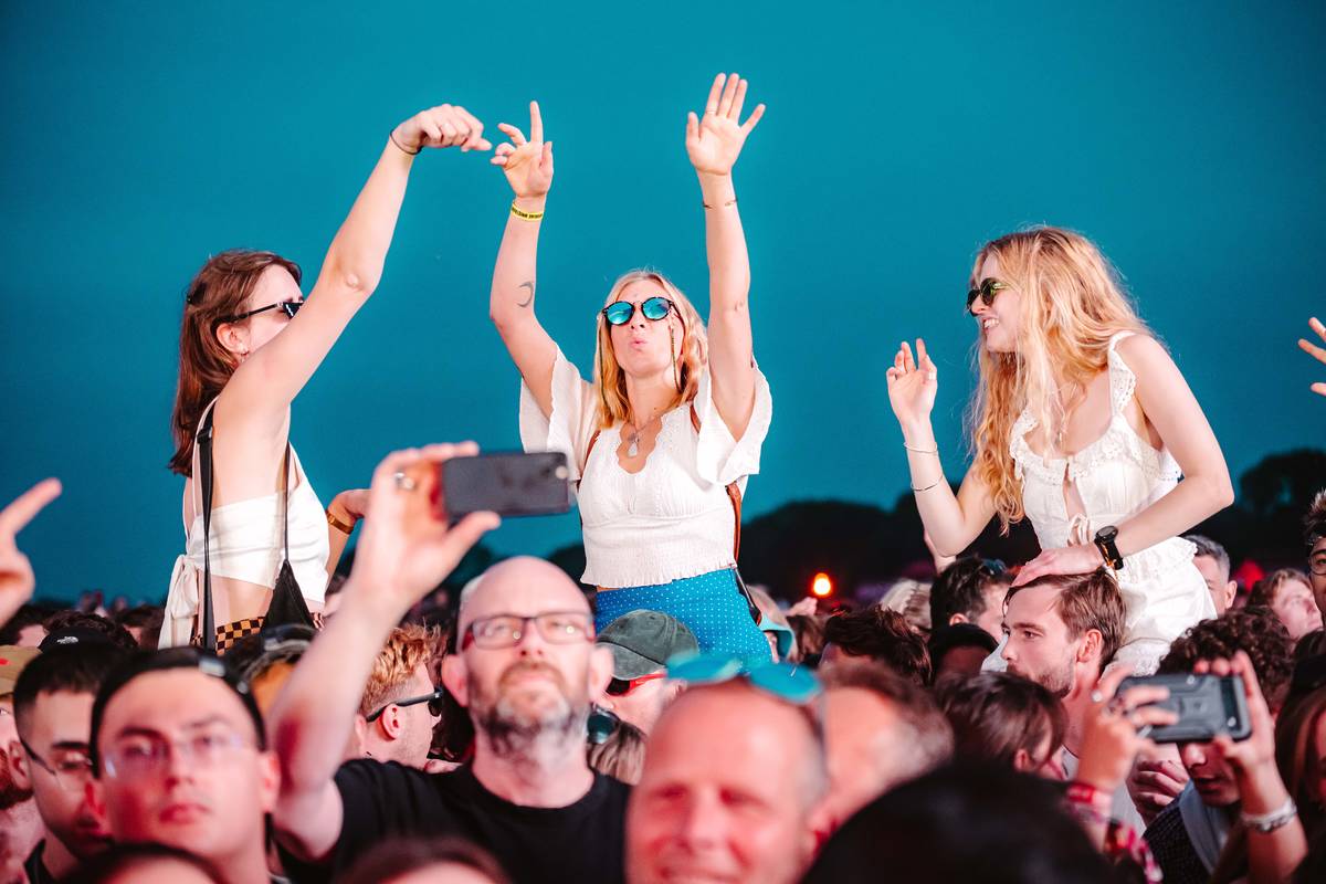 people dancing on peoples shoulders