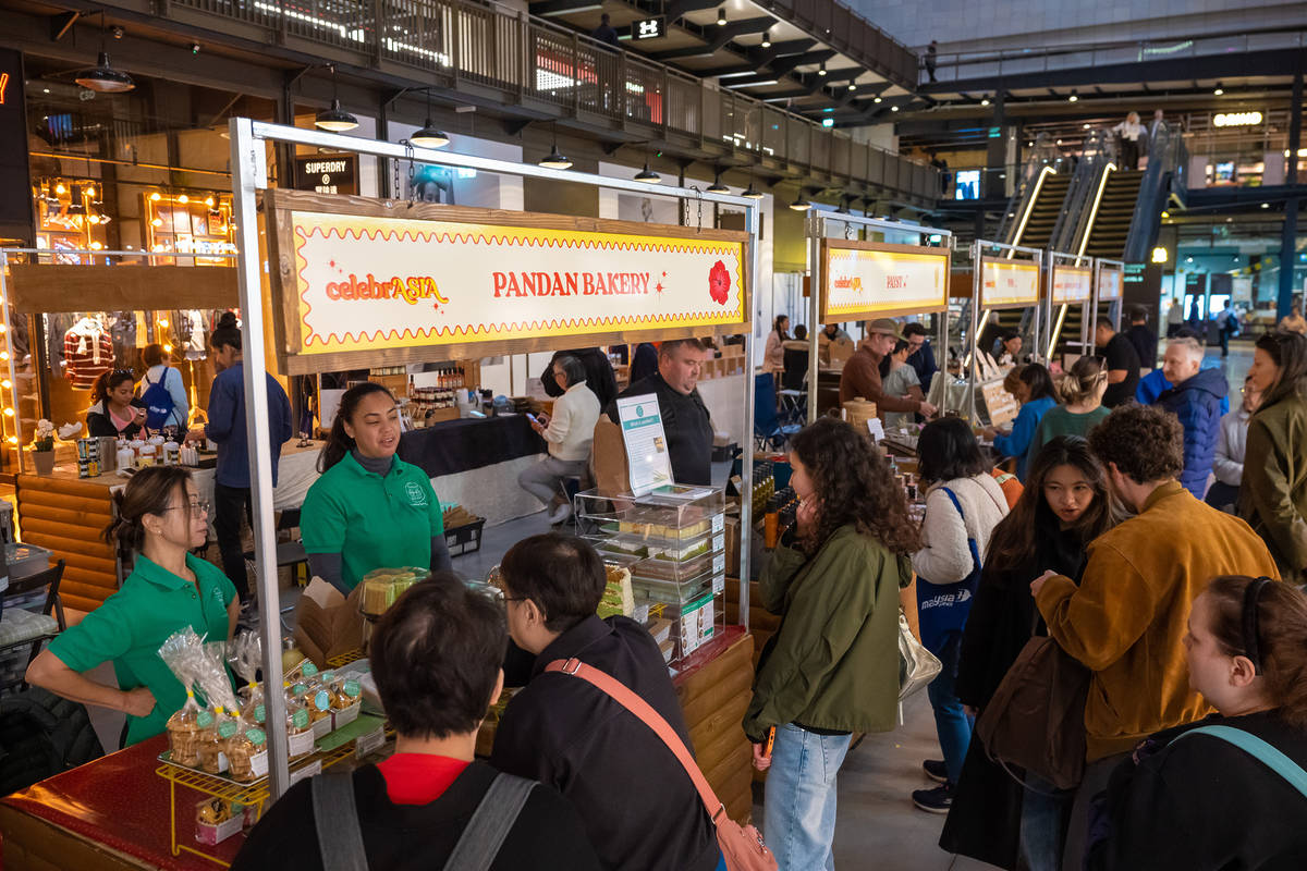people shopping at stalls at an artisan market