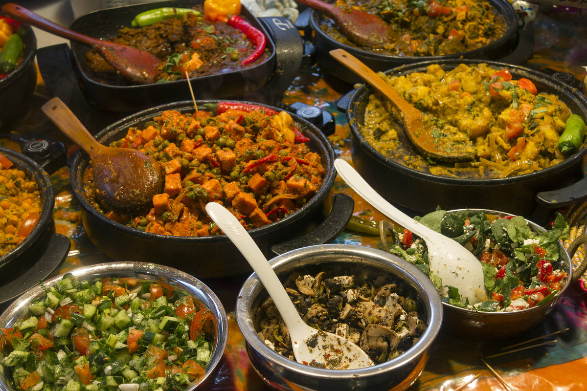 An array of dishes at indoor food market in Brick Lane