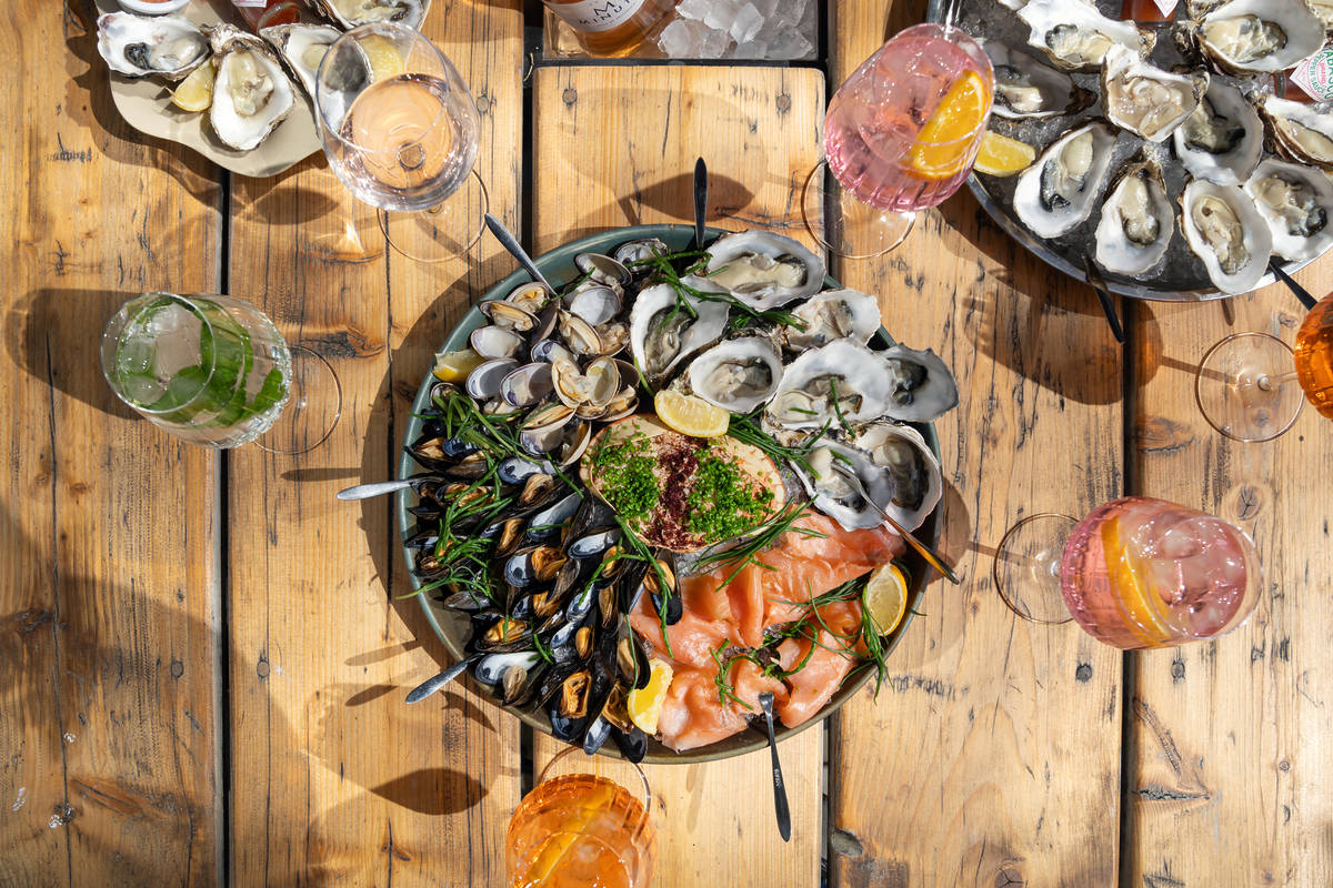 an enormous platter of oysters and shellfish