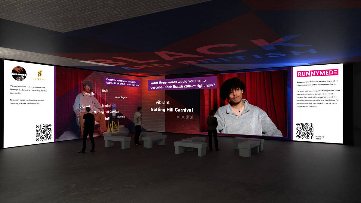 a show being displaed acoss large room-filling screens, showing Black people talking about their identities as Black and British people