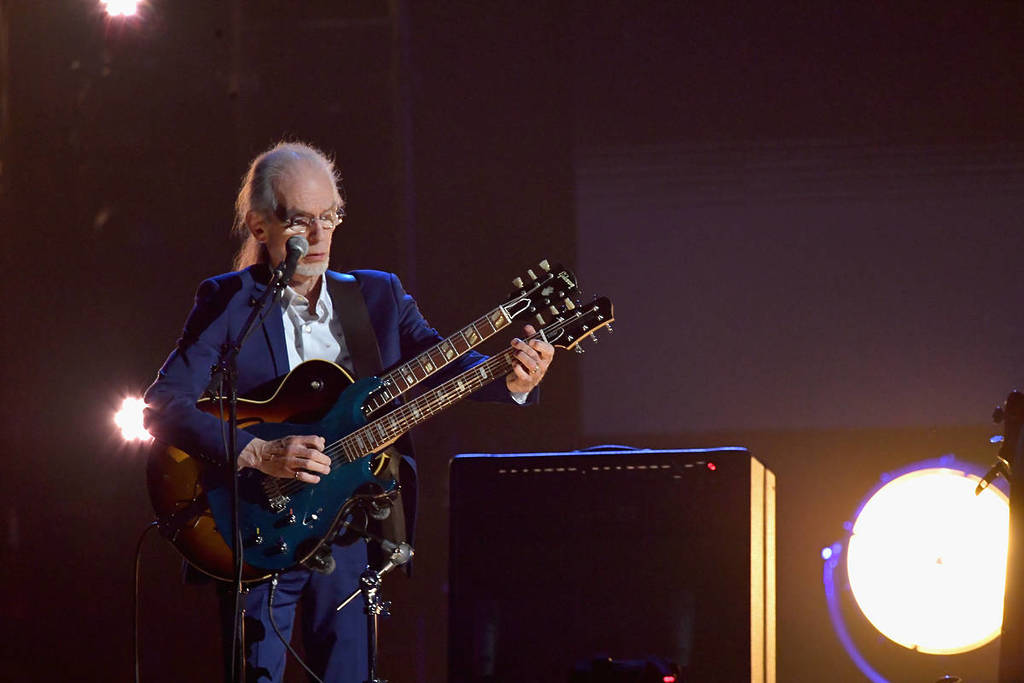 Steve Howe playing a guitar with two fretboards at the Rock & Roll Hall of Fame induction in 2017