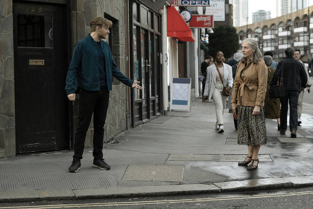 River Cartwright talks to Catherine Standish on the corner of Aldersgate Street in 'Slow Horses'