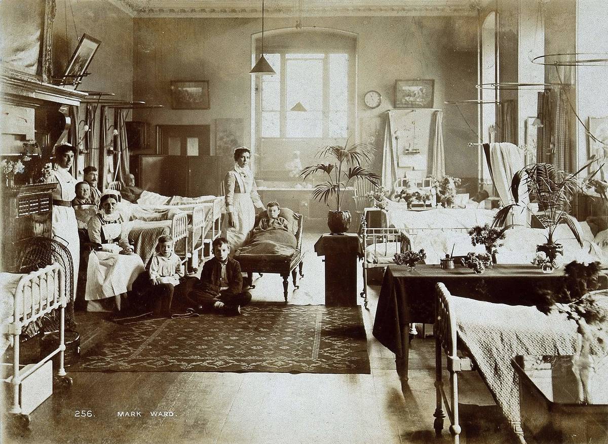 a vintage sepia photograph of patients and doctors in a room of st bartholomew's hospital