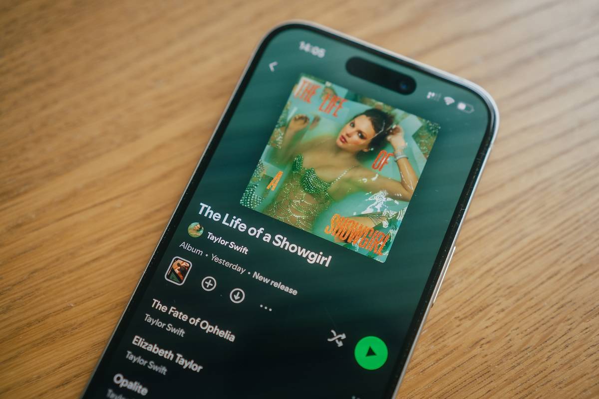 An image of a phone displaying Taylor Swift's new album on Spotify