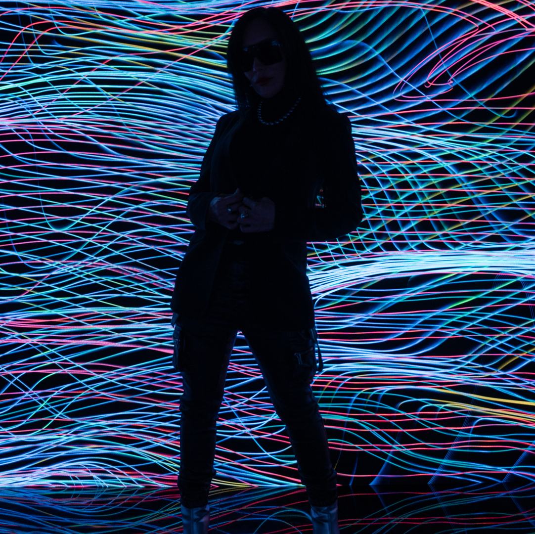 Person standing in front of the Heart Space installation by Krista Kim.