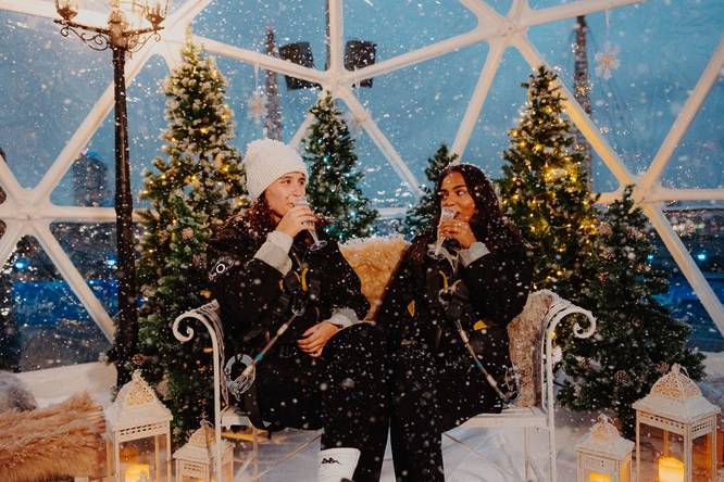 Up At The O2, pair of festive Londoners enjoying a glass of bubbly atop the O2