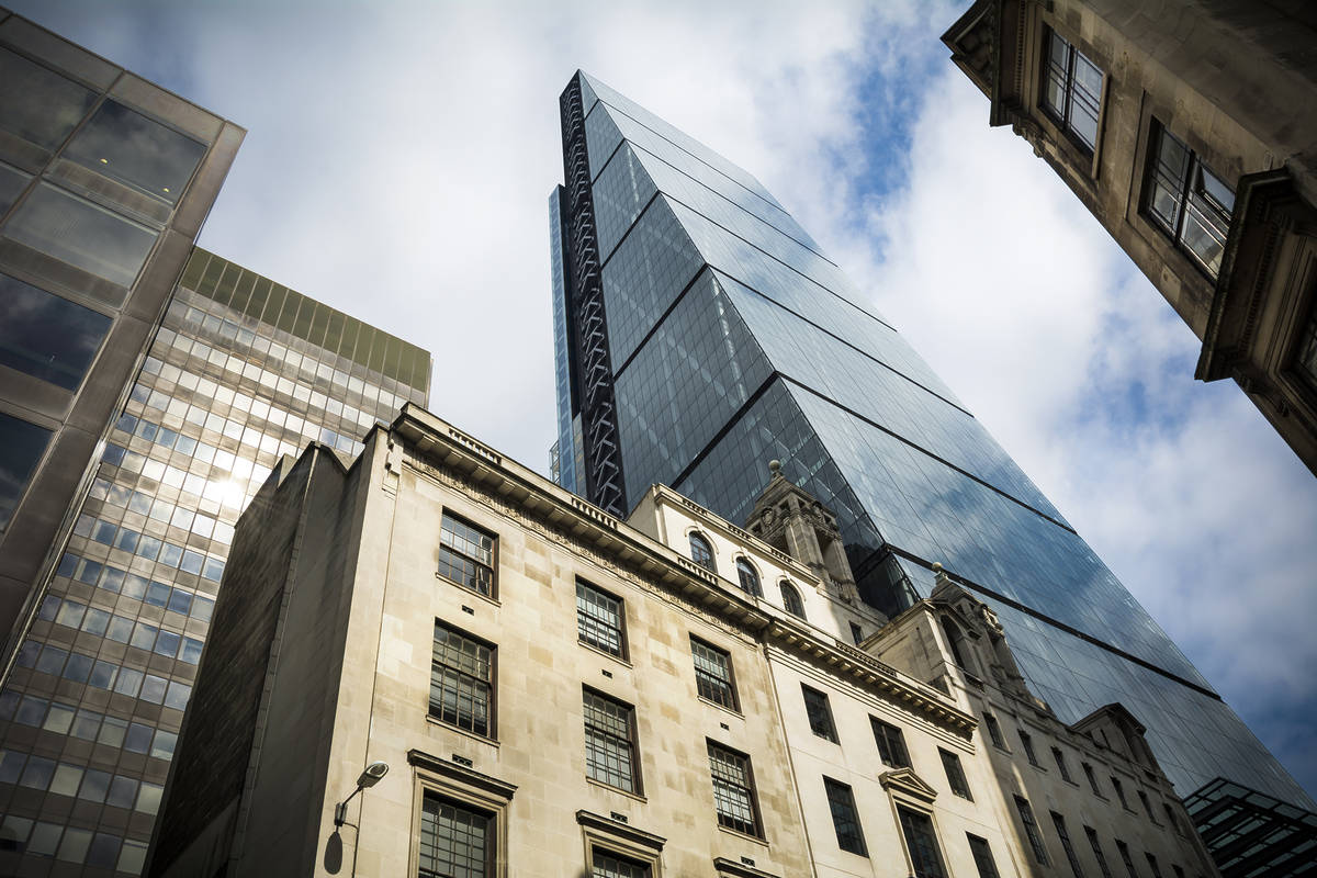 the cheesegrater aka leadenhall building towering over nearby buildings