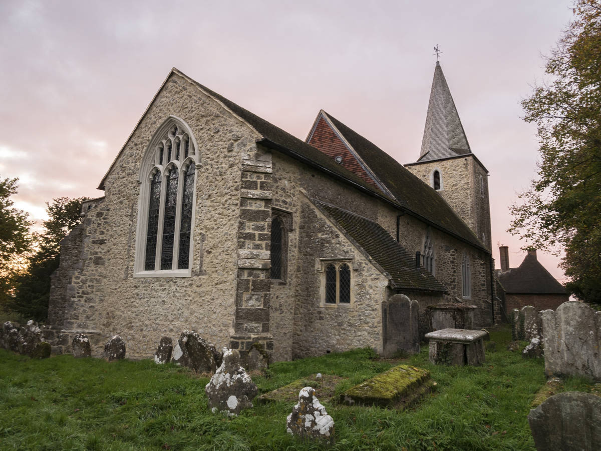 a haunted looking church in a small village in the uk