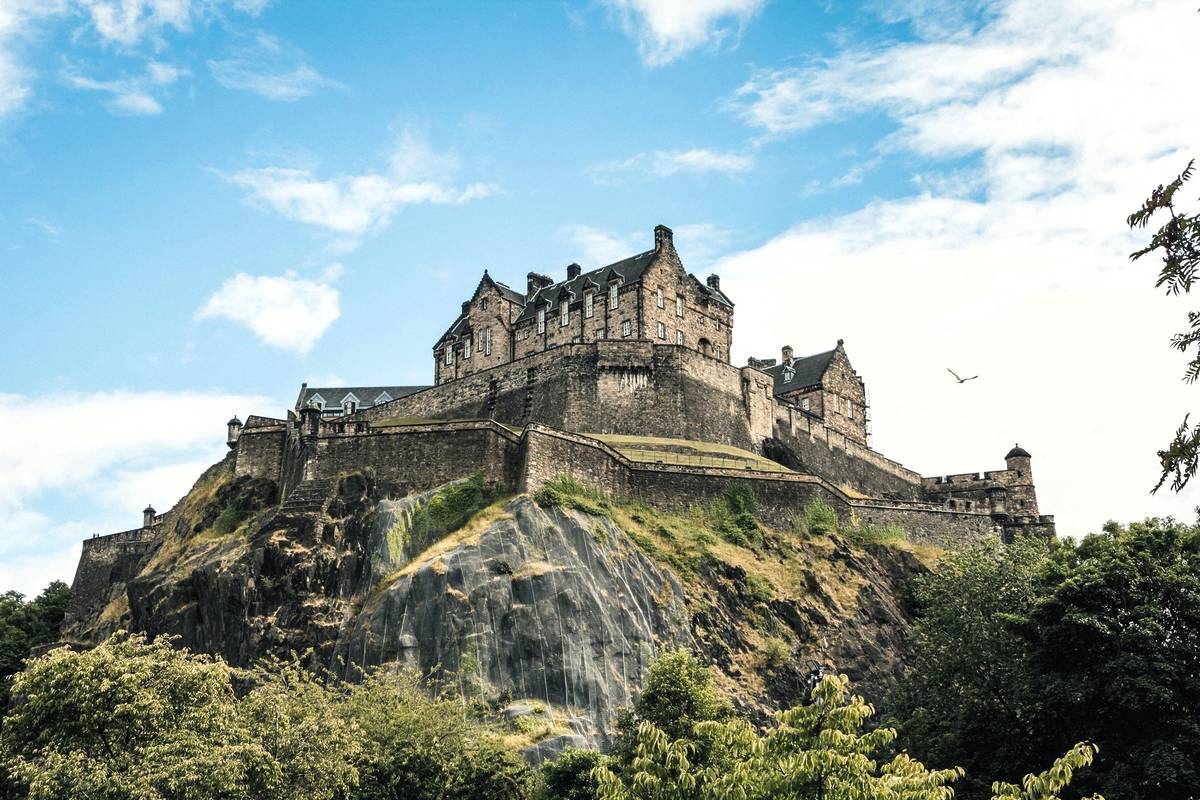 a view of edinburgh castle perched atop a hill