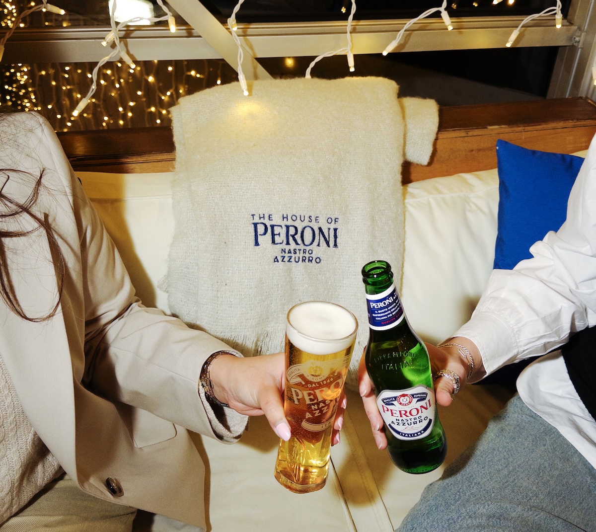 peroni winter apres ski hangout, 2 hands cheers peroni beer