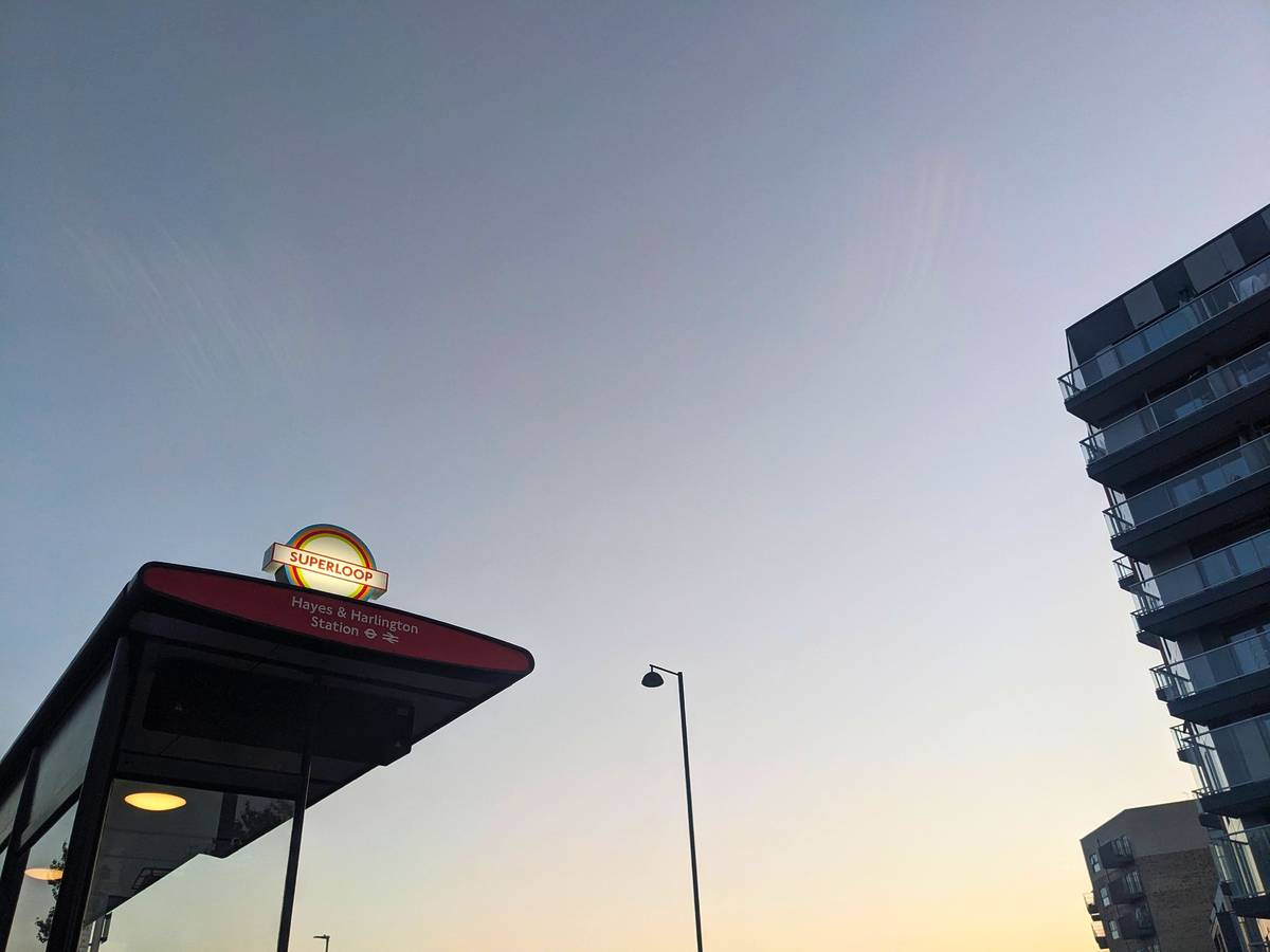 A Superloop bus stop at sunset