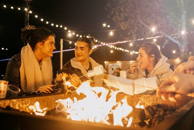 Group toasting marshmallows at the South Bank