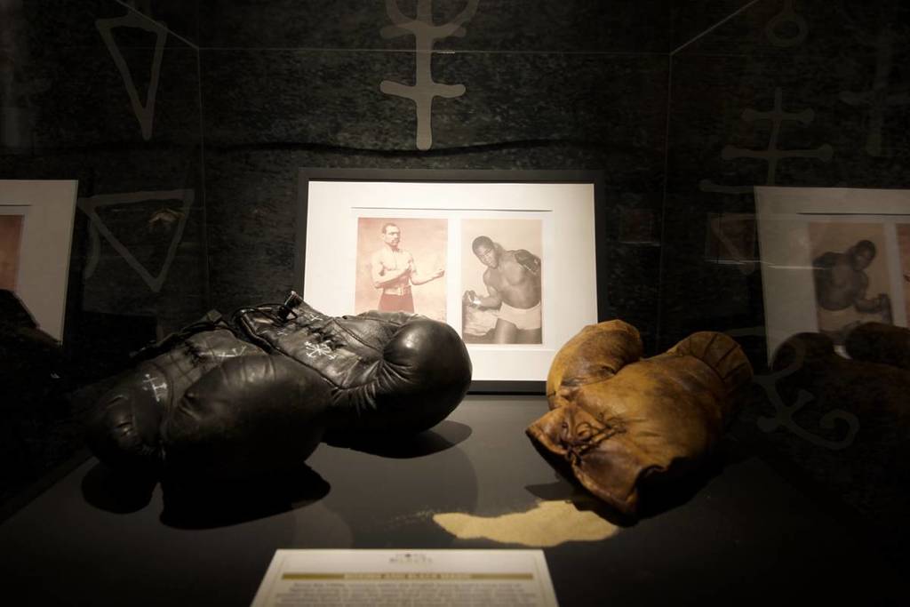 boxing gloves with black magic symbols at Dark Secrets Exhibition