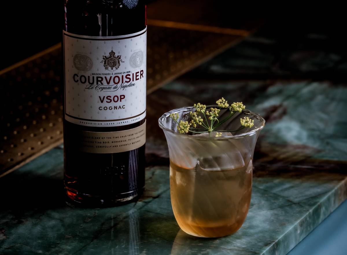 Cocktail with a bottle of Courvoisier VSOP.
