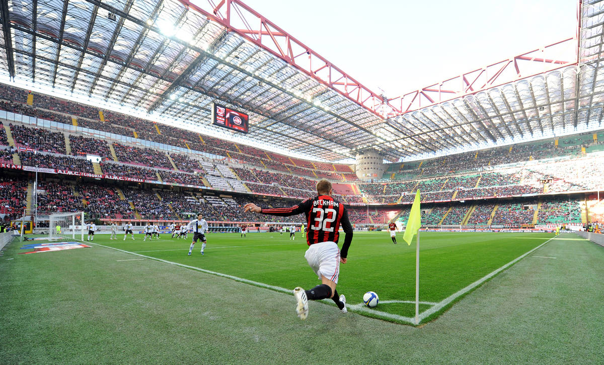 AC Milan soccer player David Beckham kicks the ball to cross during the Italian Serie A soccer macth at San Siro stadium, in Milan