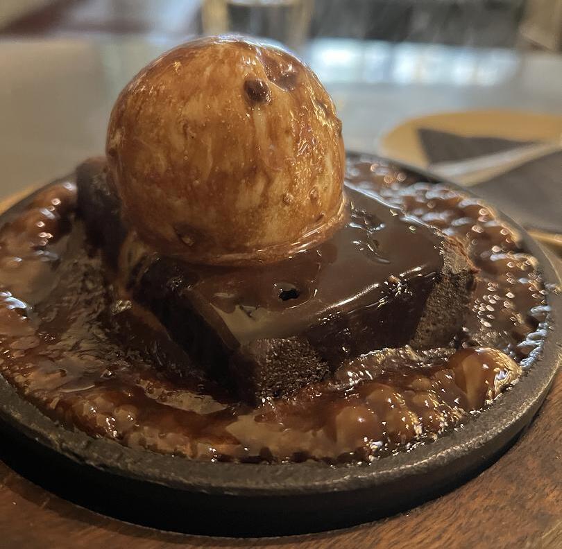 Brownie dessert with ice cream on top from Fatt Pundit in Soho, London.