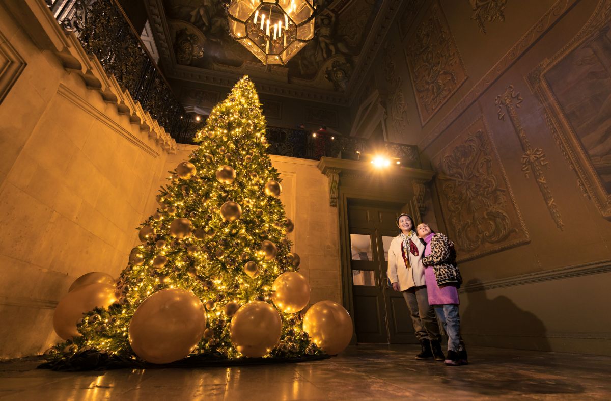 A huge Christmas tree inside a room at Hampton Court Palace