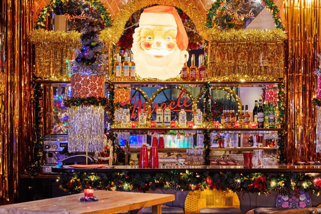miracle at henrietta bar in london covered in tinsel and festive decor
